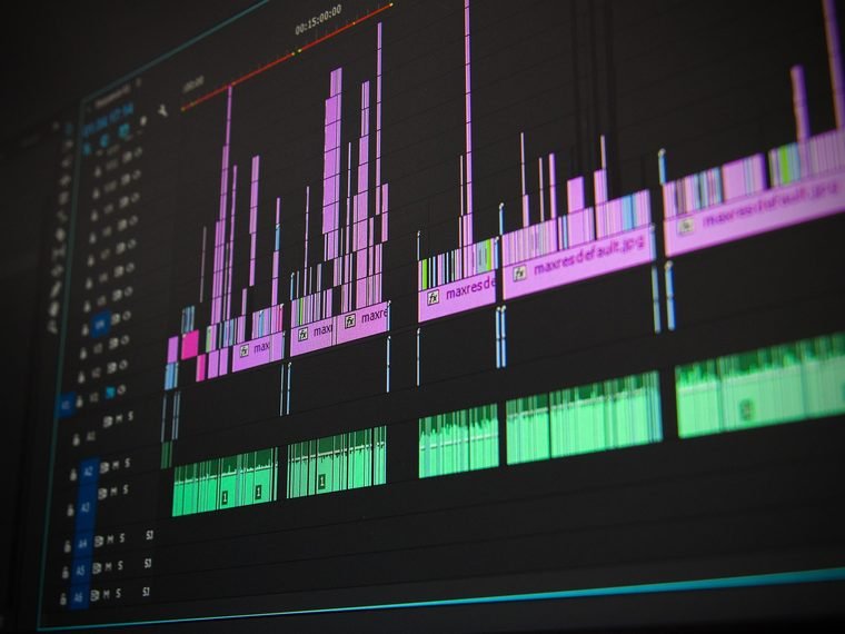 Video editing timeline with clips and waveforms